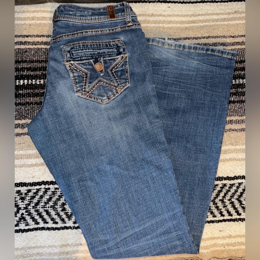 Bootcut Jeans
- People’s Liberation 
- Size 7/8
- Medium wash colored